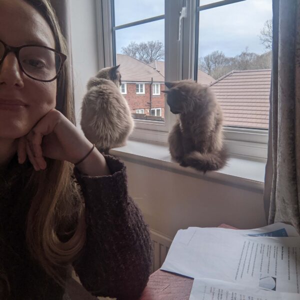 Hannah, the author of Ragdoll Cat Advice with her two ragdoll cats, Fudge and Teddy.